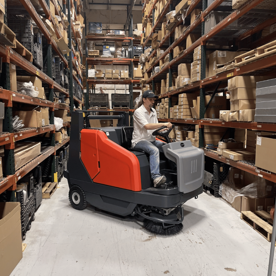 powerboss rider sweepers in warehouse